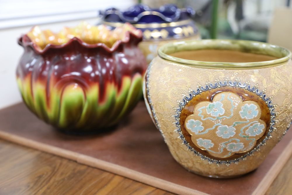 Two Doulton stoneware jardinieres, three similar small pots and a Bretby jardiniere (6)